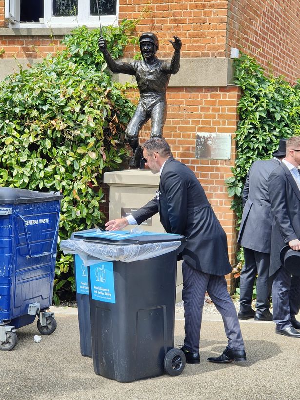 Frankie Dettori statue behind bins at Ascot races  