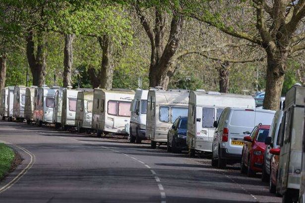 A view of vans and caravans by the side of a road in Clifton Down