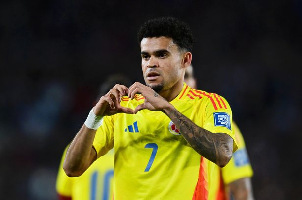Luis Diaz celebrates after scoring the team's first goal during the FIFA World Cup 2026 South American Qualifier match between Argentina and Colombia.  