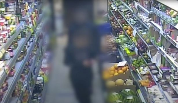 Blurred footage of Ava White's killer entering a shop shortly after stabbing her