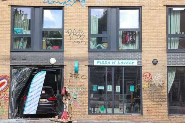 A car crashed into the front of Pizza Is Lovely on Sunday
