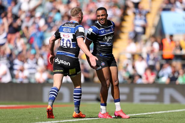 Finn Russell celebrates with team-mate with Max Ojomoh after the latter's crucial second-half try
