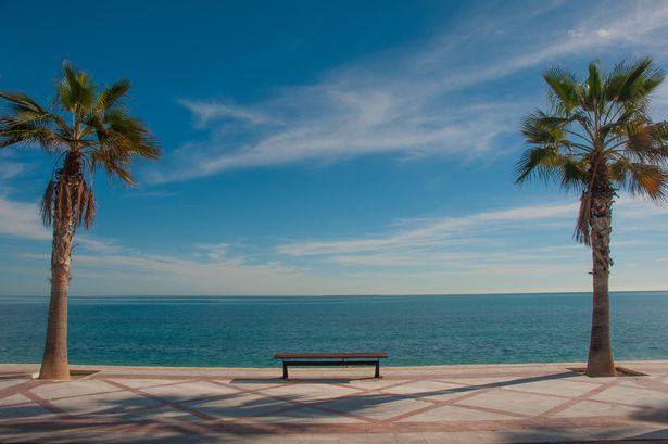A bench on the seafront of Albir, looking out to sea, Spain