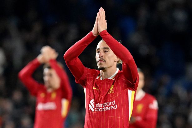 Kostas Tsimikas applauding Liverpool's fans