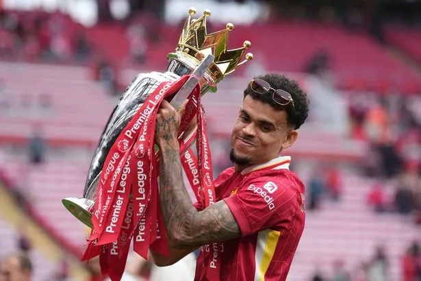Luis Diaz holding the Premier League trophy
