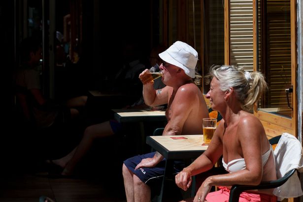 People enjoying a pint of beer in Benidorm, Spain