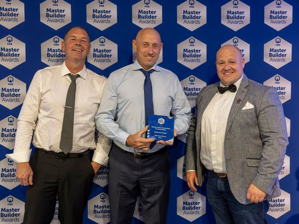 Darren Dauncey and Mike Robson receiving the Federation of Master Builders (FMB) Cymru award for 'Wales' Best Bathroom 2025'