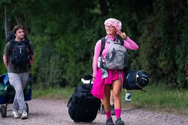 Festival goers arrive for the start of the 2025 Glastonbury Festival, June 25 2025