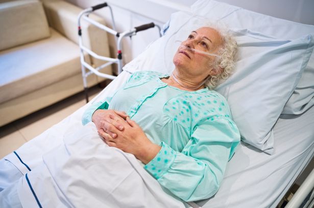 Woman in hospital bed