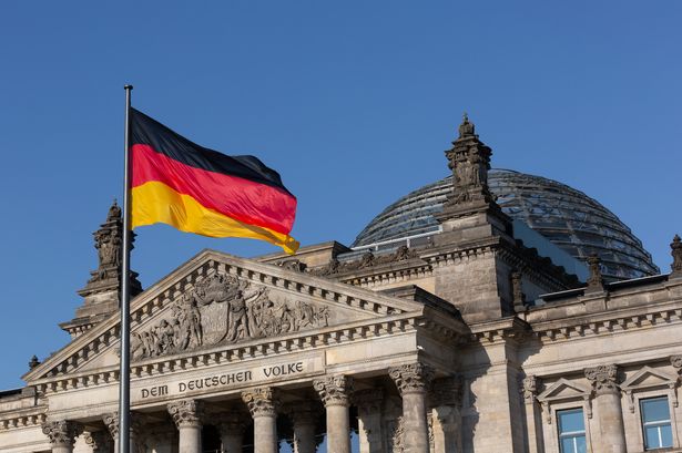 Reichstag Dome with German flag - landmark Berlin Reichstag, Deutscher Bundestag/ German parliament building