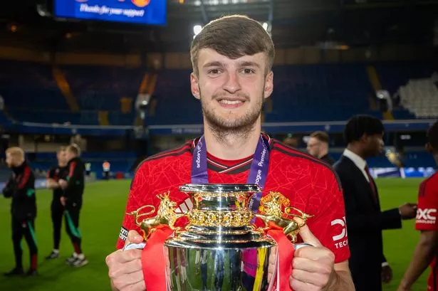 Jack Kingdon poses with the Under-18s Premier League National trophy.