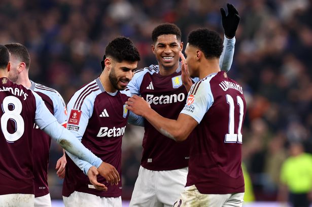 Ollie Watkins celebrates with his Aston Villa teammates.