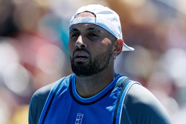 Nick Kyrgios of Australia looks dejected