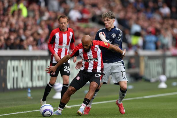 Bryan Mbeumo competes with Alejandro Garnacho for possession.