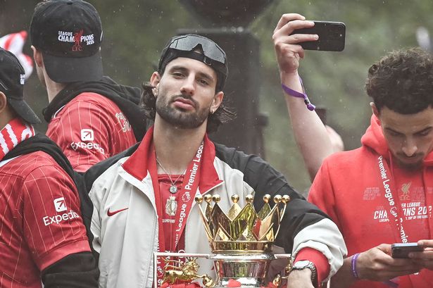 Liverpool midfielder Dominik Szoboszlai celebrates with the Premier League trophy