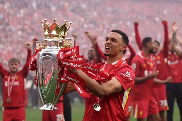 LIVERPOOL, ENGLAND - MAY 25:  Trent Alexander-Arnold of Liverpool, celebrates with Premier League trophy after his final appearance for Liverpool as Liverpool are crowned the Champions of the Premier League for the 2024/25 Season, following the Premier League match between Liverpool FC and Crystal Palace FC at Anfield on May 25, 2025 in Liverpool, England. (Photo by Carl Recine/Getty Images)