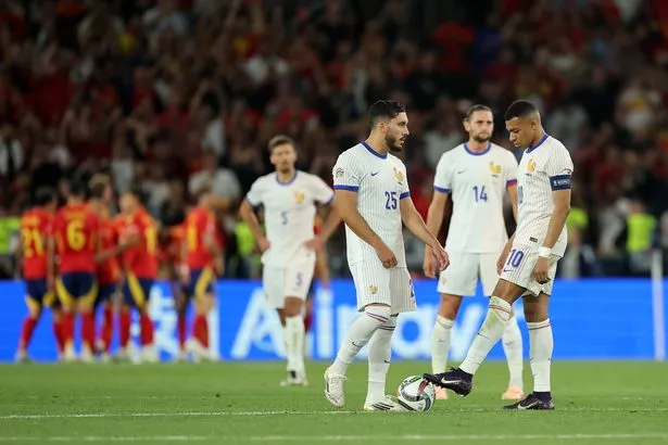 STUTTGART, GERMANY - JUNE 05: Rayan Cherki and Kylian Mbappe of France look dejected after Lamine Yamal of Spain (not pictured) scores his team's fifth goal during the UEFA Nations League 2025 semifinal match between Spain and France at Stuttgart Arena on June 05, 2025 in Stuttgart, Germany. (Photo by Alex Grimm/Getty Images)