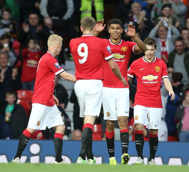 Ashley Fletcher of Manchester United U21s celebrates scoring their third goal during the Barclays U21 Premier League match between United and Manchester City at Old Trafford 
