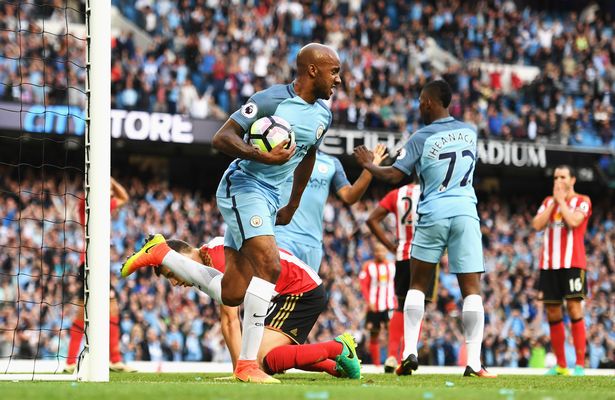 Fabian Delph celebrates after Paddy McNair's own goal