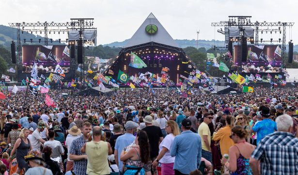 GLASTONBURY, ENGLAND - JUNE 23: People gather in front of the main Pyramid Stage as artists perform on Day 3 of Glastonbury Festival 2023 on June 23, 2023 in Glastonbury, England. (Photo by Anna Barclay/Getty Images)