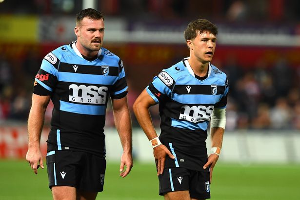 Hill (right) left Cardiff to join a team in Australia but has now been forced to retire