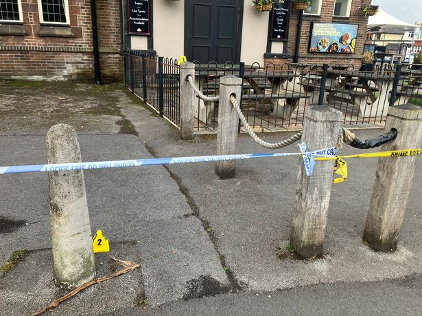 Evidence markers outside the Fairway Inn this morning
