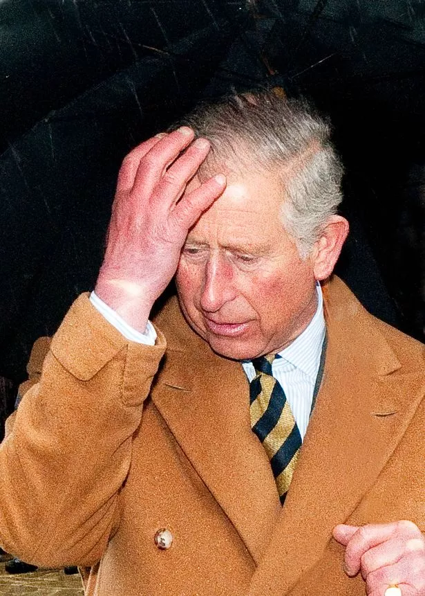 HRH King Charles of Great Britain looking anxious and perplexed wearing an overcoat