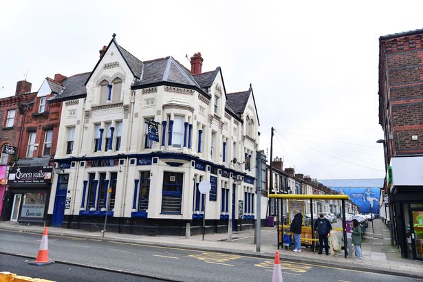 The Brick pub on County Road, with Goodison Park in the distance