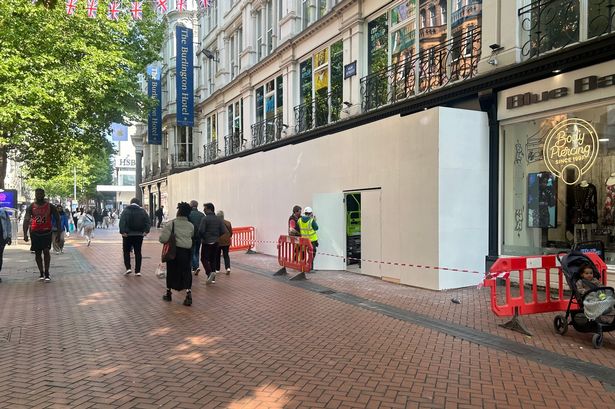 Photo shows white boards around the two units