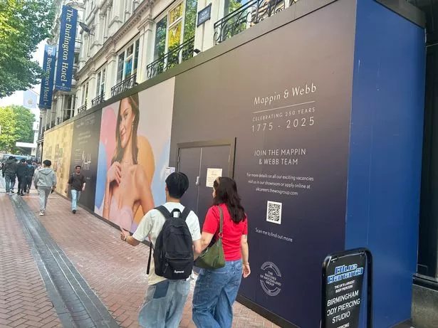 Photo shows hoardings around the units
