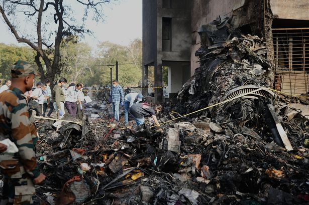 Rescuers work at the site of the horror plane crash