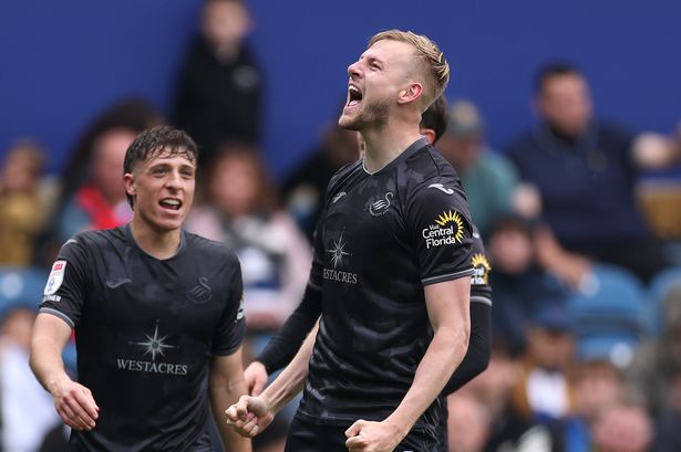 Harry Darling celebrates a goal for Swansea City