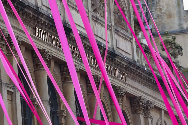Pink ribbon starts to make its way up Whiteladies Road today, Thursday June 12, 2025, starting from the Royal West of England Academy