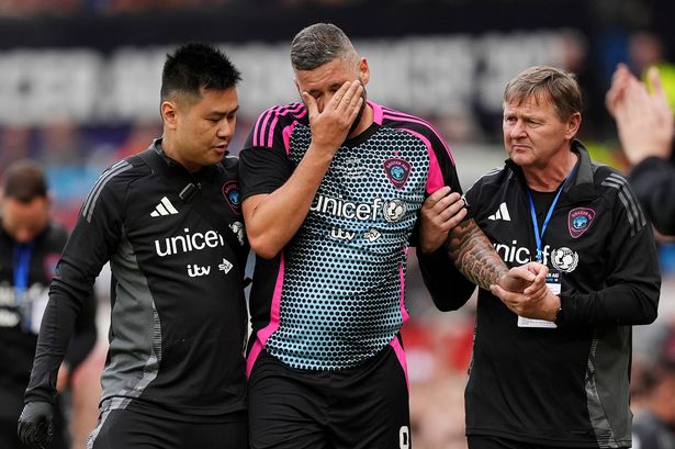 World XI's Tony Bellew (centre) reacts as he is carried off after going down injured during Soccer Aid for UNICEF 2025 at Old Trafford, Manchester. 