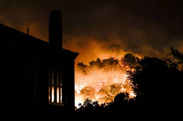  Smoke rises as firefighting teams respond the wildfire that broke out in Chios, Greece on June 22, 2025