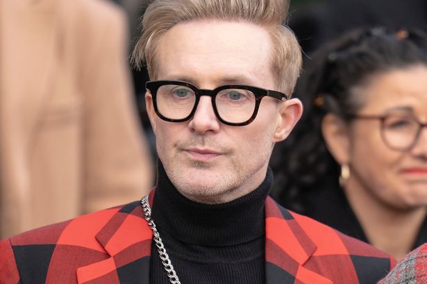 Steps star Ian H Watkins wearing a tartan suit