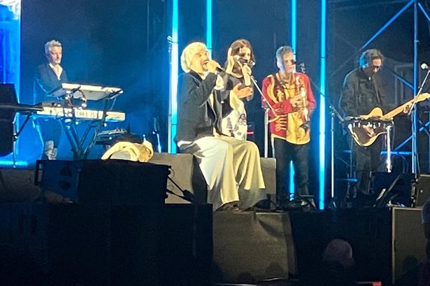 James frontman Tim Booth carries on with the set stitting down after injuring his ankle in a fall at Plymouth Summer Sessions on the Hoe, June 12, 2025