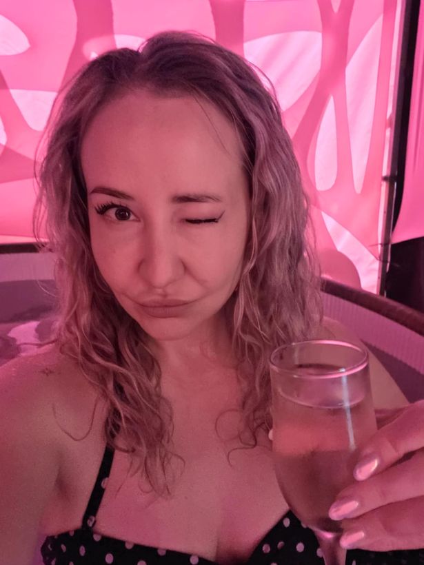 Francesca Newton in a hot tub