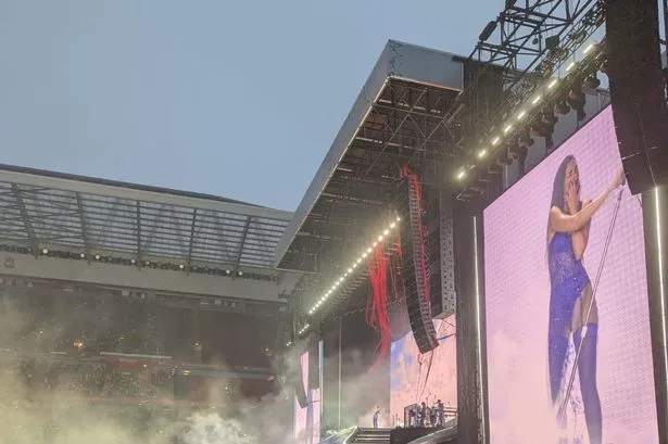 Dua Lipa on stage at Anfield 