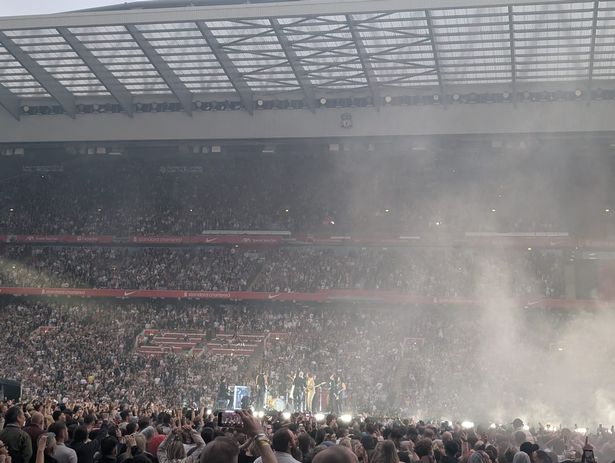 Dua Lipa with Dave McCabe from the Zutons on stage at Anfield