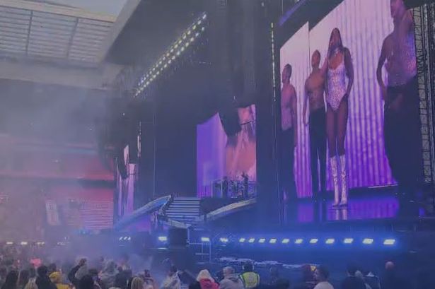 Dua Lipa performing One Kiss at Anfield Stadium