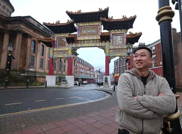 Henry Chiu from North Garden Restaurant at the Chinese Arch on Nelson Street