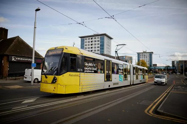 A yellow Metrolink Manchester tram