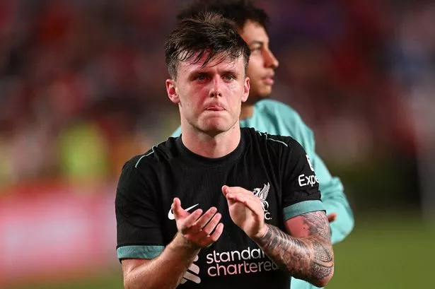 Ben Doak of Liverpool showing his appreciation to the fans at the end of the pre-season match between Manchester United and Liverpool