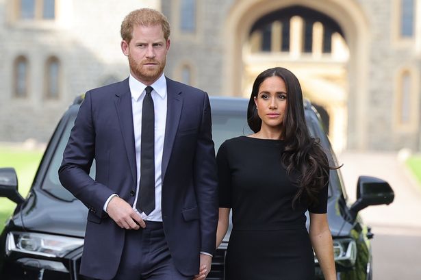 Prince Harry, Duke of Sussex, and Meghan, Duchess of Sussex arrive on the long Walk at Windsor Castle arrive to view flowers and tributes to HM Queen Elizabeth