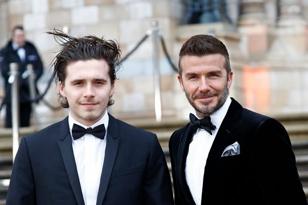 Brooklyn Beckham and his dad David Beckham