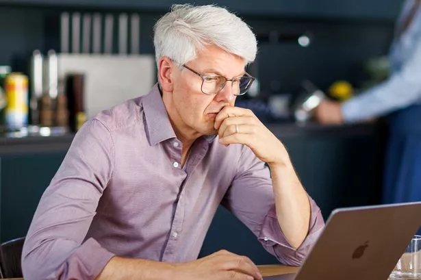 A man checks his finances