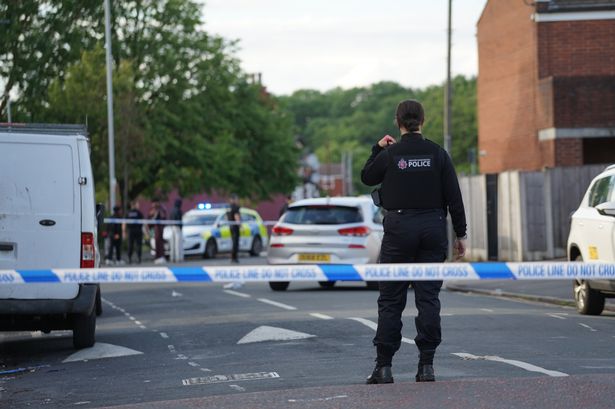 Police in Rusholme after a fellow officer's legs were crushed when rammed by a vehicle 