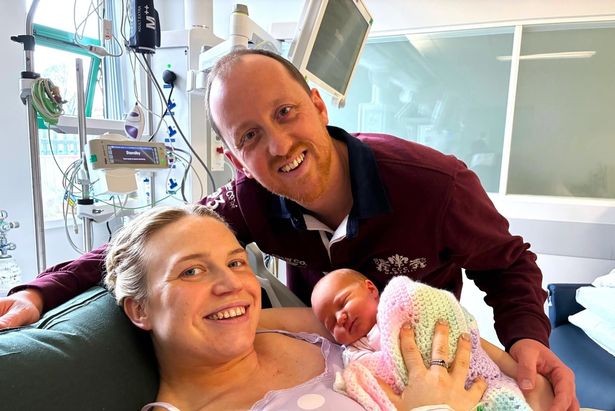 Rachel with her husband, Alex, and baby Betsy