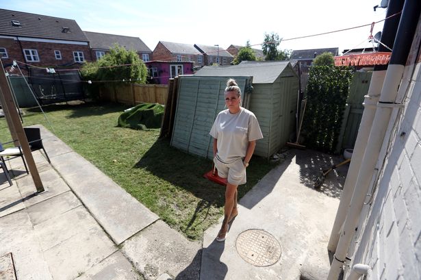 Melanie McMahon, whose garden has been flooded with sewage